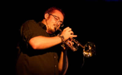 Member - Gregory Wilson-Copp on trumpet and backing vocals